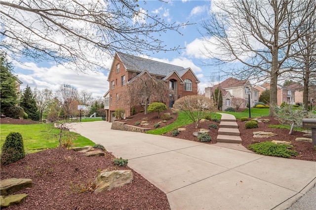 view of property exterior with a residential view, a lawn, and concrete driveway