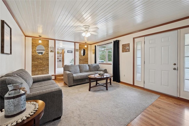 living room with light wood-style flooring, wood ceiling, crown molding, and a ceiling fan