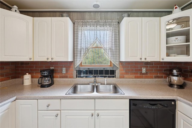 kitchen with white cabinets, dishwasher, and a sink