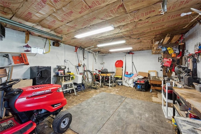 below grade area featuring a garage and a workshop area