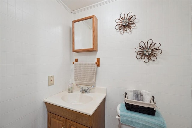 bathroom with vanity and crown molding