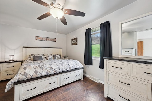 bedroom with dark wood-style flooring, baseboards, a ceiling fan, and visible vents