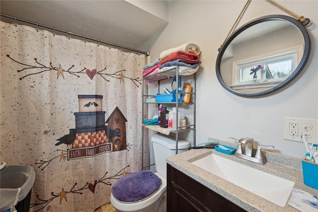 full bath featuring toilet and vanity