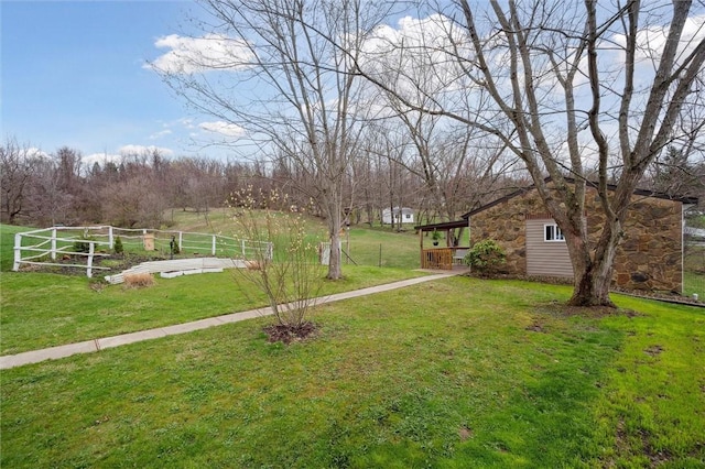 view of yard featuring a garden and fence