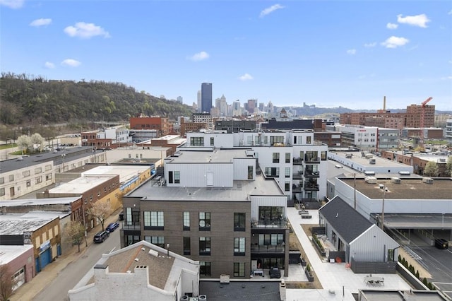 birds eye view of property with a view of city