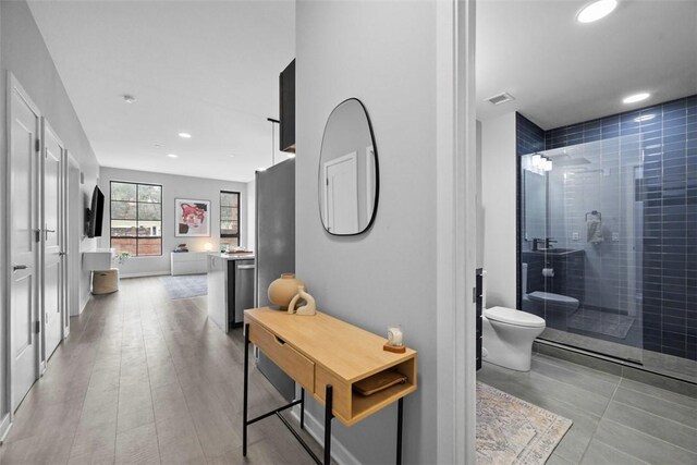 corridor featuring visible vents and recessed lighting