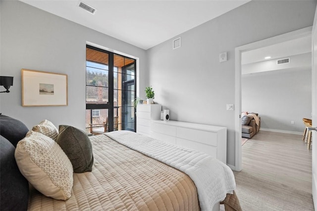 bedroom featuring visible vents and baseboards