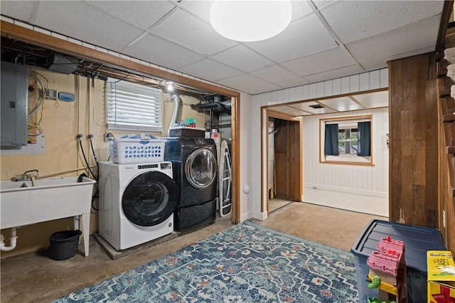 1171 Fox Terrier Dr, Bethel Park, PA 15102 - washroom with washer and dryer, electric panel, a sink, laundry area, and wooden walls