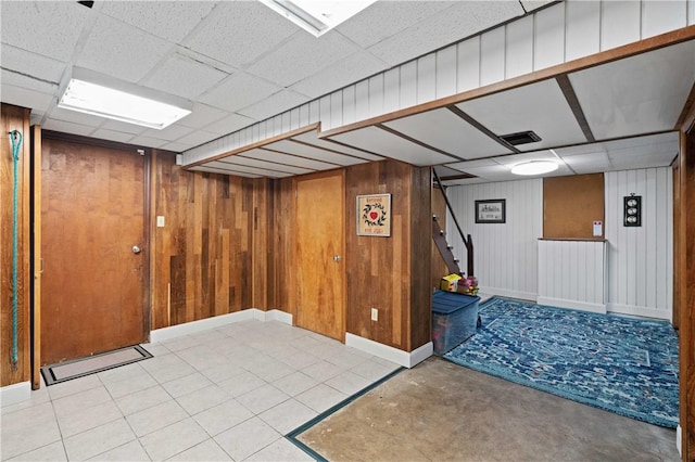 1171 Fox Terrier Dr, Bethel Park, PA 15102 - finished basement with a drop ceiling, visible vents, stairway, wood walls, and baseboards