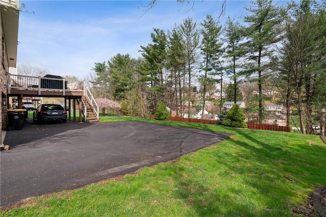 1171 Fox Terrier Dr, Bethel Park, PA 15102 - view of yard with aphalt driveway, stairway, a carport, and a wooden deck
