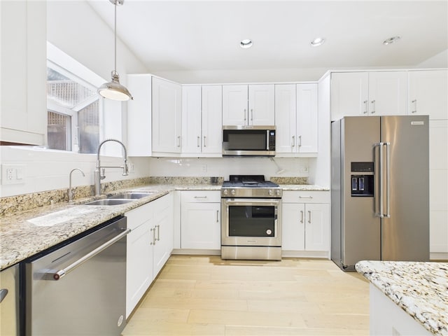 138 N Woodland Rd, Shadyside, PA 15232 - kitchen with stainless steel appliances, a sink, light wood finished floors, white cabinets, and recessed lighting