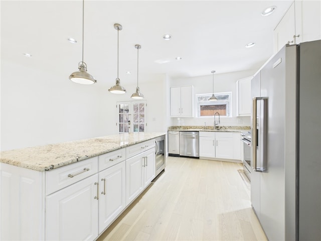138 N Woodland Rd, Shadyside, PA 15232 - kitchen with stainless steel appliances, a sink, white cabinets, and recessed lighting