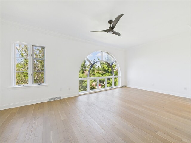 138 N Woodland Rd, Shadyside, PA 15232 - unfurnished room with healthy amount of natural light, crown molding, light wood finished floors, a ceiling fan, and baseboards