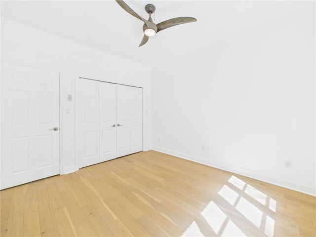 138 N Woodland Rd, Shadyside, PA 15232 - unfurnished bedroom featuring light wood-style floors, baseboards, and a closet