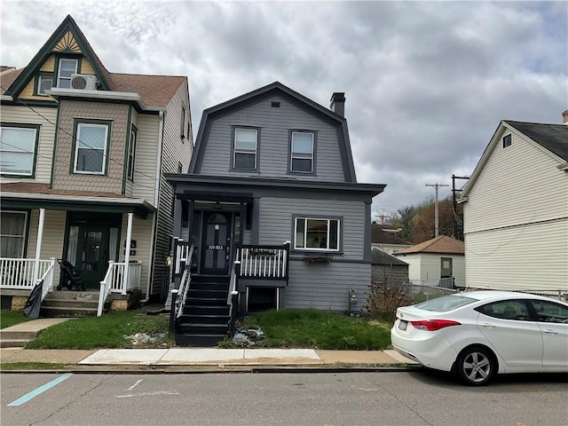 913 Russellwood Ave, Mckees Rocks, PA 15136 - view of front of home with a porch and a gambrel roof