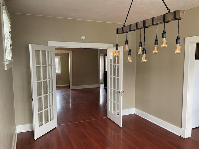 913 Russellwood Ave, Mckees Rocks, PA 15136 - empty room featuring french doors, baseboards, and wood finished floors