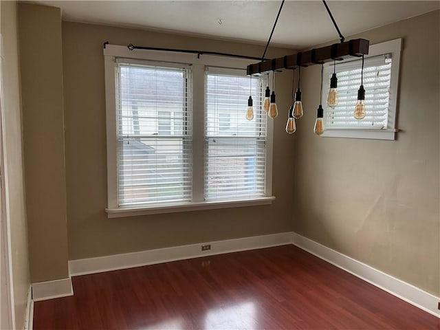 913 Russellwood Ave, Mckees Rocks, PA 15136 - unfurnished dining area featuring a wealth of natural light, baseboards, and dark wood finished floors