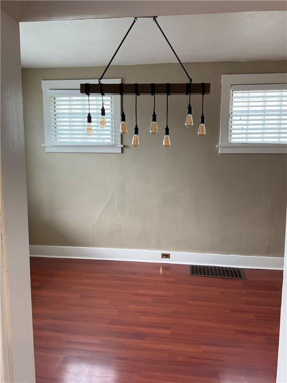 913 Russellwood Ave, Mckees Rocks, PA 15136 - empty room with visible vents, baseboards, and wood finished floors