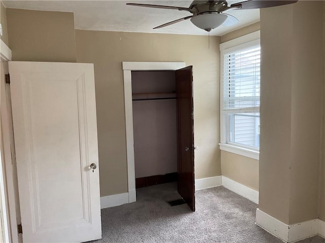 913 Russellwood Ave, Mckees Rocks, PA 15136 - unfurnished bedroom with a closet, baseboards, visible vents, ceiling fan, and carpet flooring
