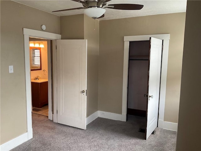 913 Russellwood Ave, Mckees Rocks, PA 15136 - unfurnished bedroom with a sink, a closet, baseboards, and carpet flooring