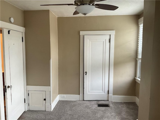 913 Russellwood Ave, Mckees Rocks, PA 15136 - unfurnished bedroom featuring visible vents, baseboards, ceiling fan, and carpet floors