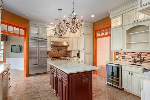 422 Heights Dr, Pine Twp Nal, PA 15044 - kitchen with a chandelier, under cabinet range hood, wine cooler, stainless steel appliances, and a sink