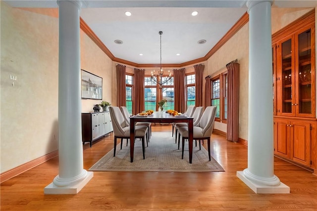 422 Heights Dr, Pine Twp Nal, PA 15044 - dining room with light wood-style flooring, ornate columns, a notable chandelier, and baseboards
