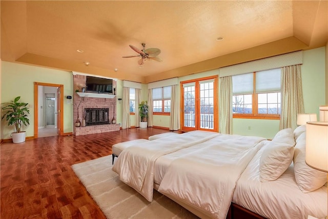 422 Heights Dr, Pine Twp Nal, PA 15044 - bedroom featuring a tray ceiling, wood finished floors, a fireplace, and baseboards