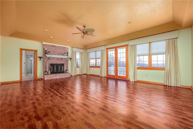 422 Heights Dr, Pine Twp Nal, PA 15044 - unfurnished living room with a tray ceiling, ceiling fan, wood finished floors, and baseboards