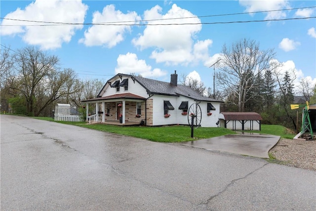313 N Market St, Carmichaels/Cumblnd, PA 15320 - view of front of property with a carport, a chimney, driveway, a front lawn, and covered porch