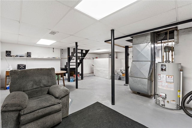 313 N Market St, Carmichaels/Cumblnd, PA 15320 - finished basement featuring water heater, visible vents, a paneled ceiling, and heating unit