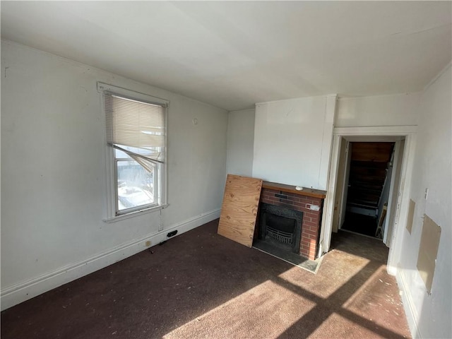 846 Florence Ave, East Mckeesport, PA 15035 - unfurnished living room featuring a fireplace and baseboards