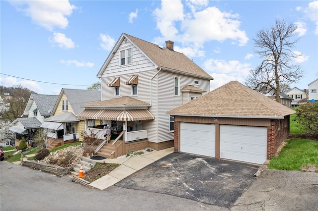 16 Elm St, Burgettstown Boro, PA 15021 - view of front of property featuring a chimney, a residential view, driveway, and roof with shingles