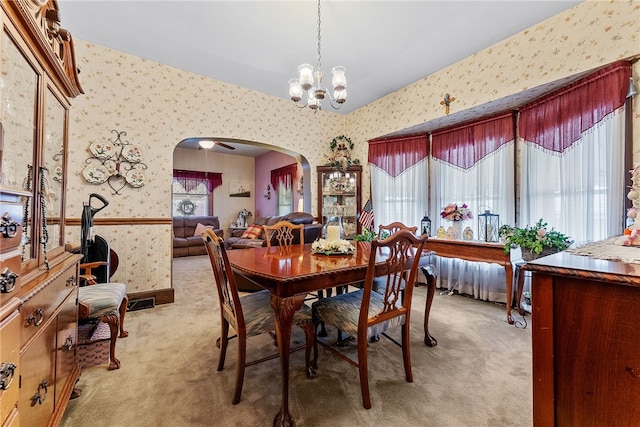 16 Elm St, Burgettstown Boro, PA 15021 - dining area with arched walkways, wallpapered walls, light colored carpet, and an inviting chandelier