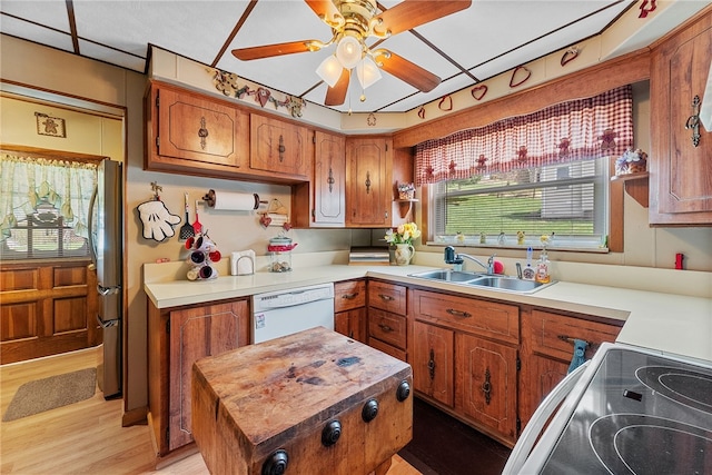 16 Elm St, Burgettstown Boro, PA 15021 - kitchen featuring electric stove, white dishwasher, brown cabinetry, and a sink