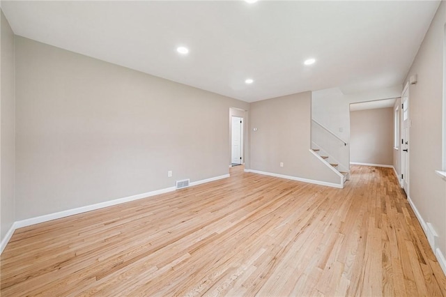 226 Old Leechburg Rd, Plum Boro, PA 15239 - spare room featuring light wood-style flooring, baseboards, visible vents, and stairway