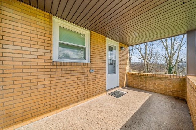 226 Old Leechburg Rd, Plum Boro, PA 15239 - doorway to property featuring a patio area and brick siding