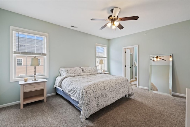 bedroom featuring visible vents, baseboards, a ceiling fan, and carpet flooring