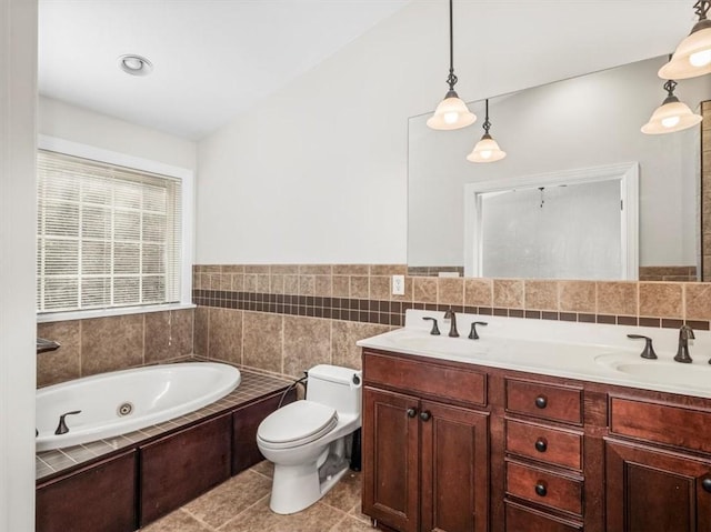 full bath featuring a sink, a whirlpool tub, toilet, and tile patterned floors
