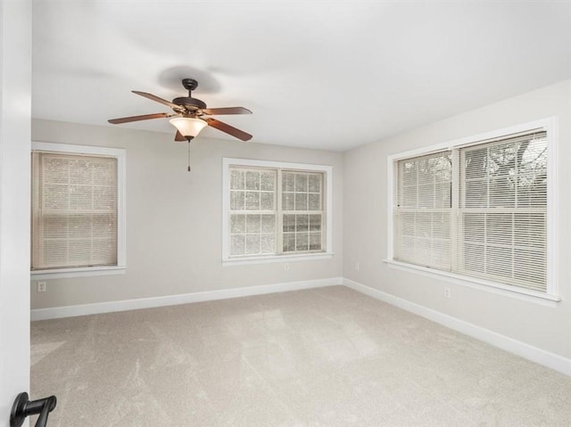 unfurnished room with ceiling fan, baseboards, and carpet floors