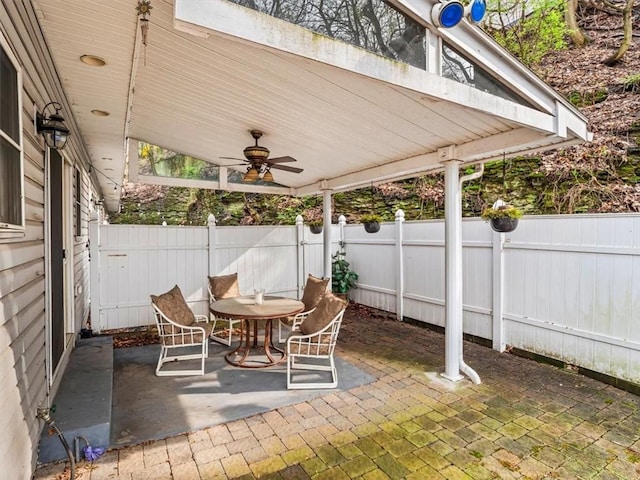 view of patio / terrace featuring a fenced backyard and a ceiling fan