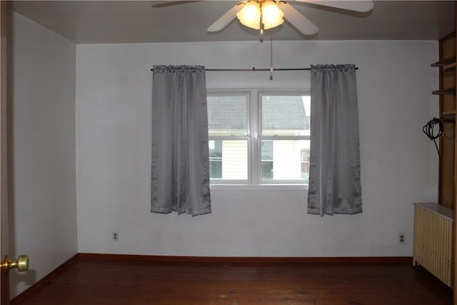 607 River St, W Brownsville, PA 15417 - spare room featuring radiator heating unit, baseboards, wood finished floors, and ceiling fan