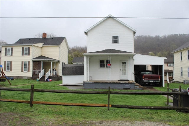 607 River St, W Brownsville, PA 15417 - view of front facade with a front lawn and fence