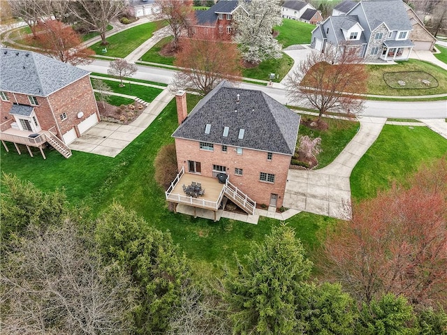 birds eye view of property with a residential view