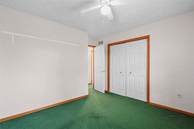 unfurnished bedroom with visible vents, baseboards, a closet, a ceiling fan, and carpet flooring