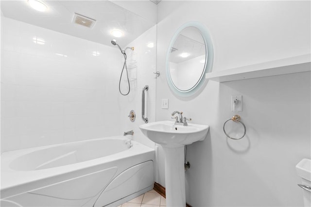 bathroom featuring visible vents, tile patterned floors, a sink, and shower / bath combination
