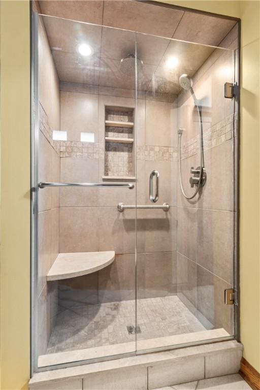 full bath featuring a shower stall