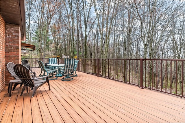 wooden deck with outdoor dining space