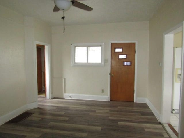 entrance foyer featuring wood finished floors, ceiling fan, baseboards, and visible vents