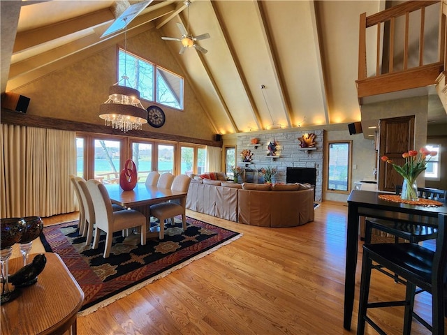 288 Latonka Dr, Jackson Twp Mer, PA 16137 - dining room with high vaulted ceiling, beamed ceiling, a fireplace, a skylight, and ceiling fan